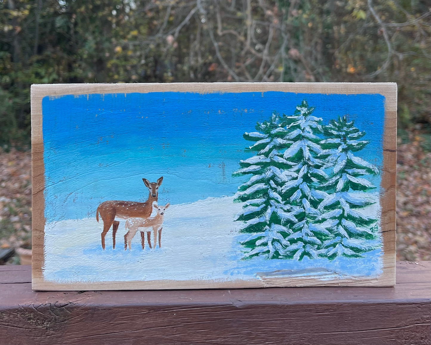 Deer and fawn in snow